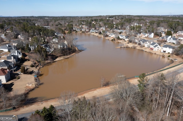 drone / aerial view with a residential view and a water view