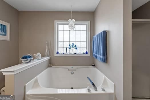 full bathroom featuring a garden tub