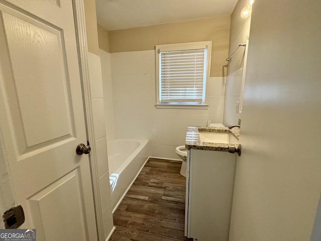 2228 Headland Dr, East Point, GA 30344 - bathroom with wood finished floors, vanity, and bathing tub / shower combination