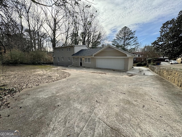 2430 Fern Valley Ct, East Point, GA 30344 - view of front of home featuring a garage and concrete driveway