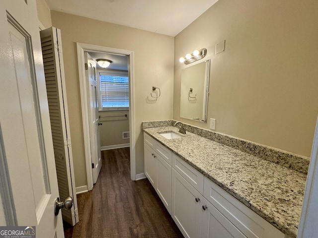 2430 Fern Valley Ct, East Point, GA 30344 - bathroom with vanity and wood finished floors