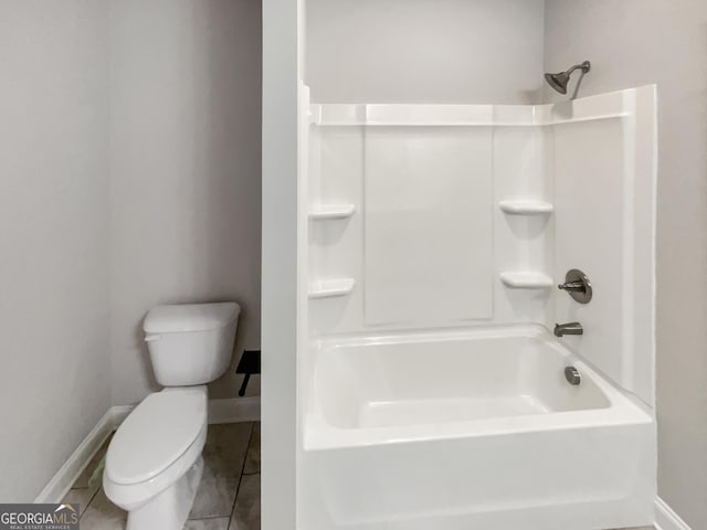 full bathroom with tile patterned floors, toilet, and baseboards