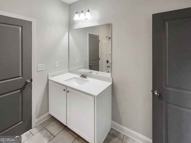 bathroom with baseboards and vanity