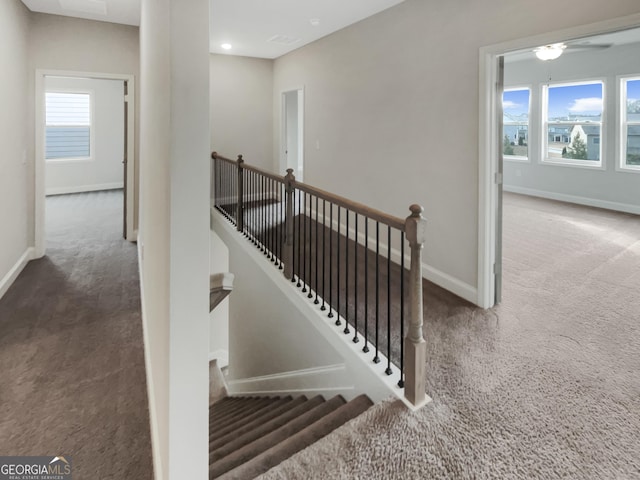 staircase with carpet flooring and baseboards