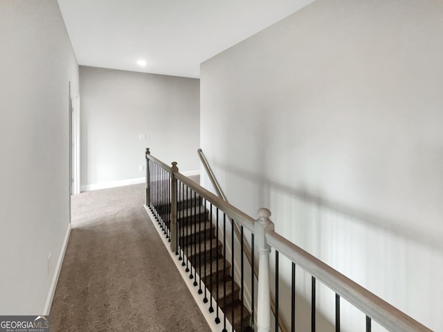 hallway with carpet floors, recessed lighting, an upstairs landing, and baseboards