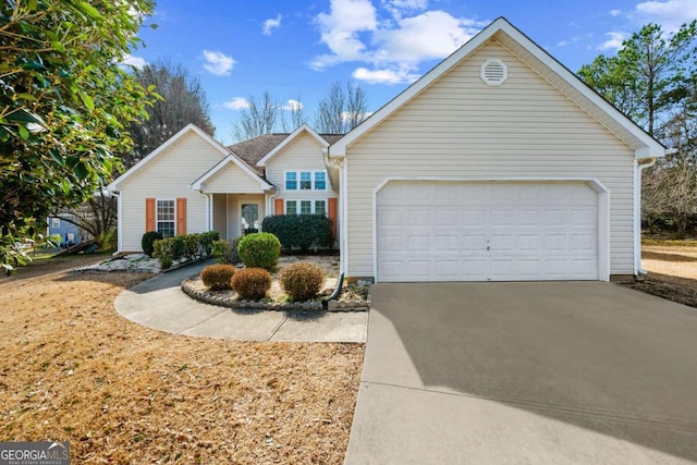 view of front facade with driveway and an attached garage