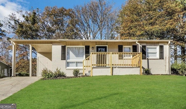 ranch-style home featuring a front yard and brick siding