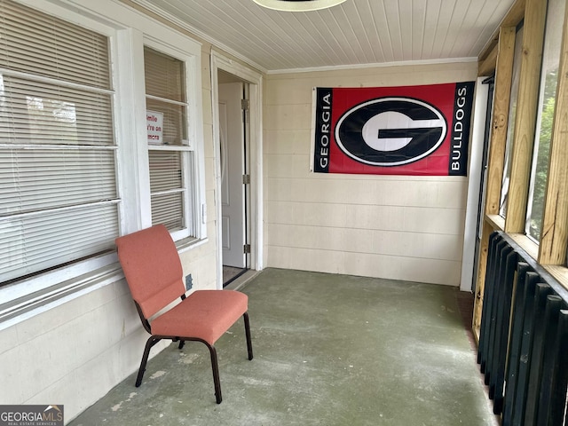 sunroom with radiator heating unit