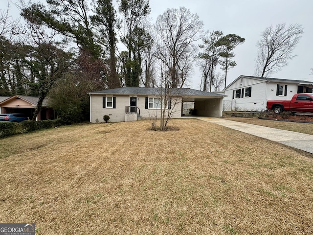 single story home with brick siding, a carport, a front lawn, and driveway