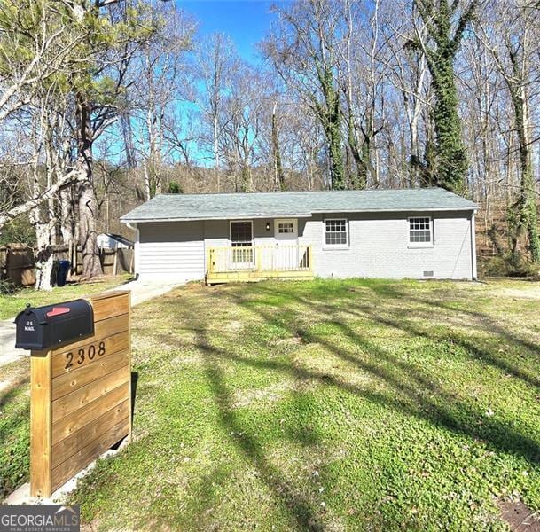 single story home with crawl space and a front yard