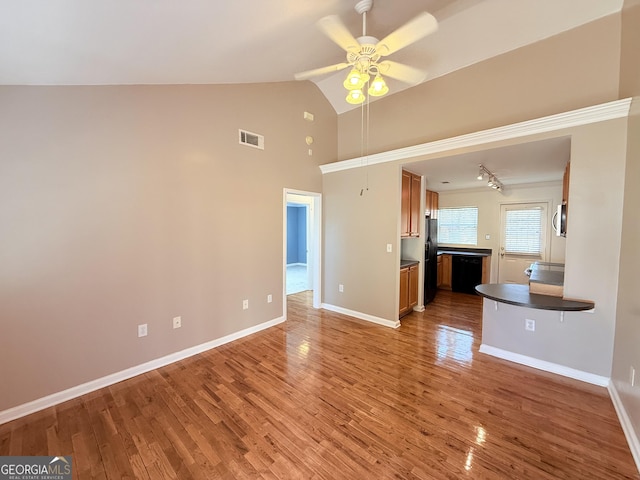 unfurnished living room with high vaulted ceiling, wood finished floors, visible vents, a ceiling fan, and baseboards