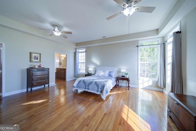 bedroom with baseboards, ceiling fan, and hardwood / wood-style floors