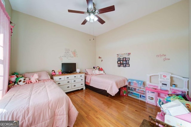 bedroom featuring ceiling fan and light wood finished floors