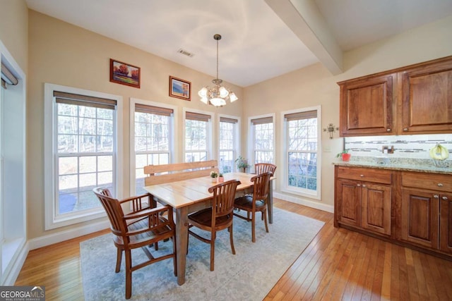 2656 Panorama Dr, Sautee Nacoochee, GA 30571 - dining room featuring light wood-style floors, baseboards, a chandelier, and beamed ceiling