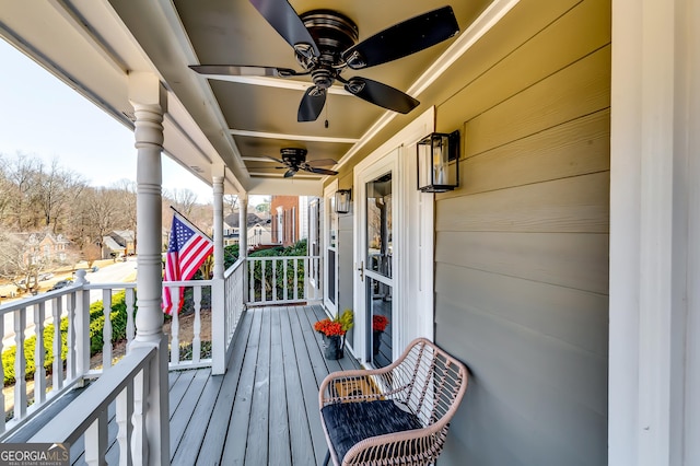 deck featuring a porch and a ceiling fan