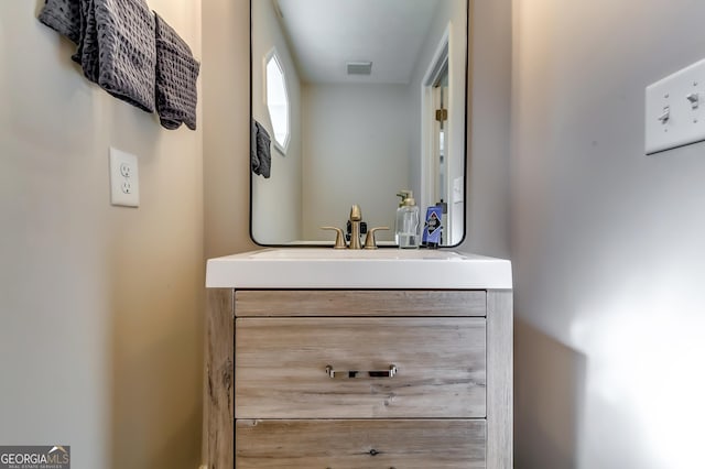 bathroom with visible vents and vanity