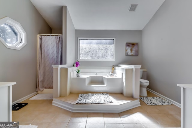 bathroom with visible vents, a shower with shower curtain, vaulted ceiling, tile patterned flooring, and a bath