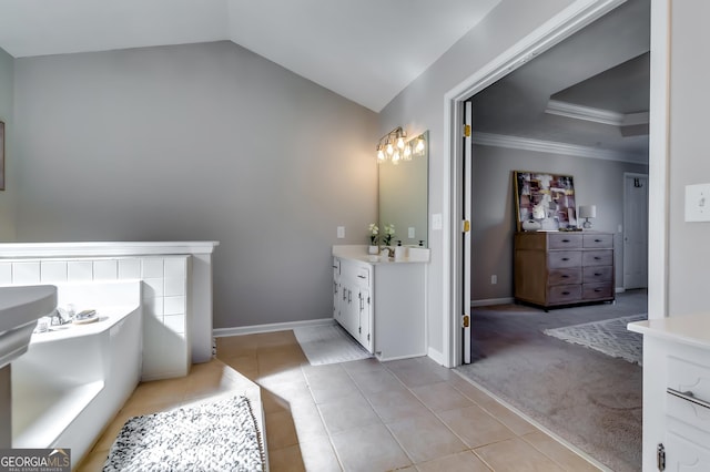 bathroom with lofted ceiling, tile patterned flooring, vanity, baseboards, and crown molding