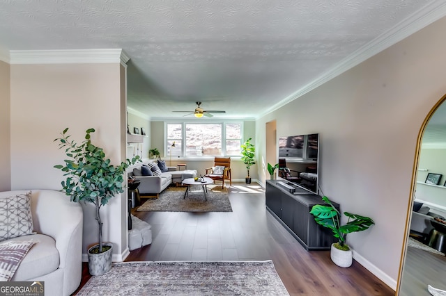 living room with crown molding, a textured ceiling, ceiling fan, and dark wood-type flooring