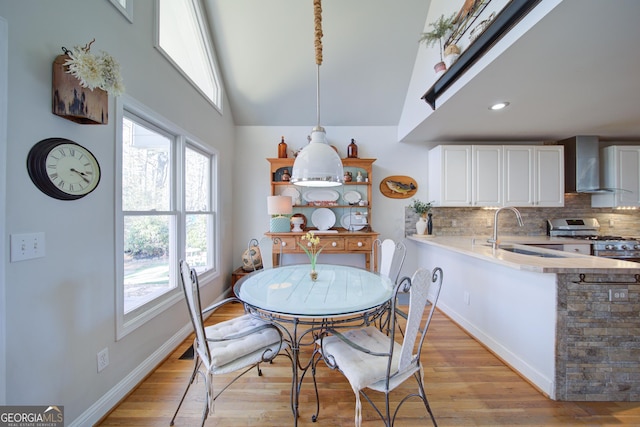 210 Wrights Mill Way, Canton, GA 30115 - dining area featuring light wood-style flooring, baseboards, and high vaulted ceiling
