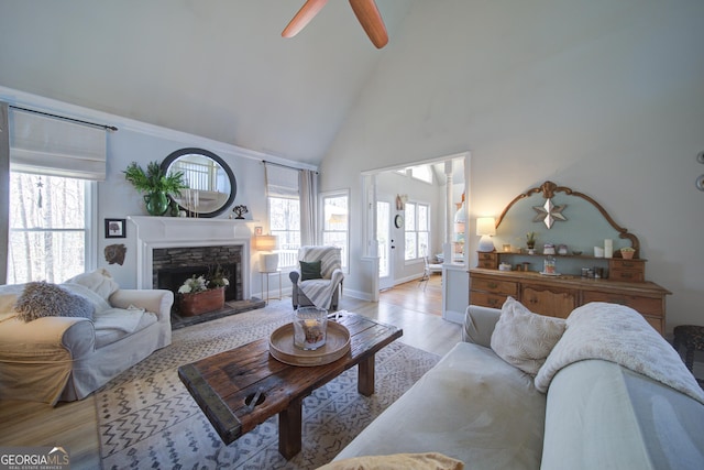 210 Wrights Mill Way, Canton, GA 30115 - living area featuring high vaulted ceiling, light wood-style floors, a fireplace, ceiling fan, and baseboards