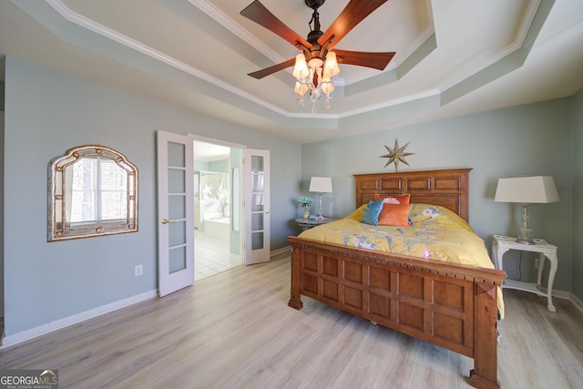 210 Wrights Mill Way, Canton, GA 30115 - bedroom featuring a tray ceiling, crown molding, light wood-type flooring, baseboards, and connected bathroom