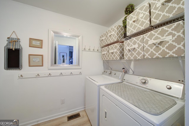 210 Wrights Mill Way, Canton, GA 30115 - laundry area with washing machine and dryer, light wood-style flooring, and baseboards