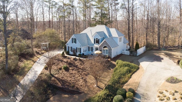 drone / aerial view featuring a view of trees