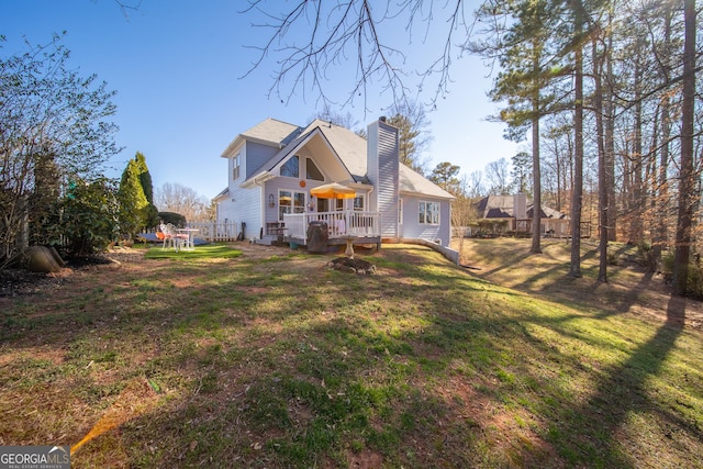 210 Wrights Mill Way, Canton, GA 30115 - rear view of property with a wooden deck, a chimney, and a lawn