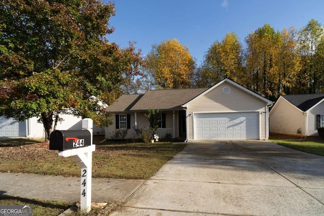 ranch-style home with a garage, concrete driveway, a front lawn, and covered porch