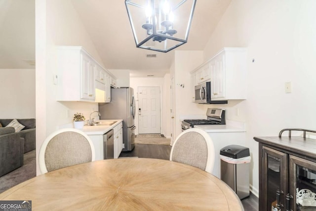 dining space with a notable chandelier
