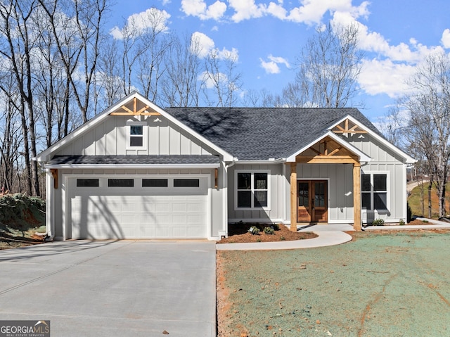 modern inspired farmhouse featuring concrete driveway, roof with shingles, board and batten siding, and french doors