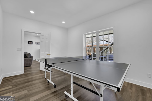 recreation room featuring baseboards, wood finished floors, and recessed lighting