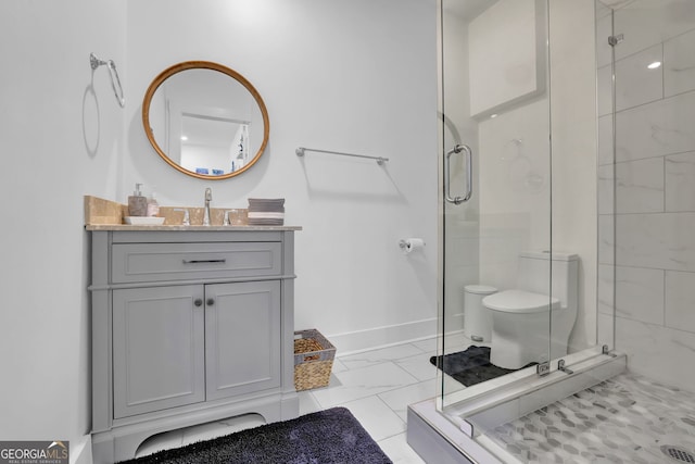 bathroom featuring toilet, vanity, baseboards, marble finish floor, and a stall shower