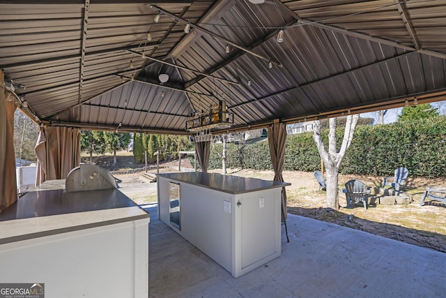 view of patio featuring area for grilling and a gazebo