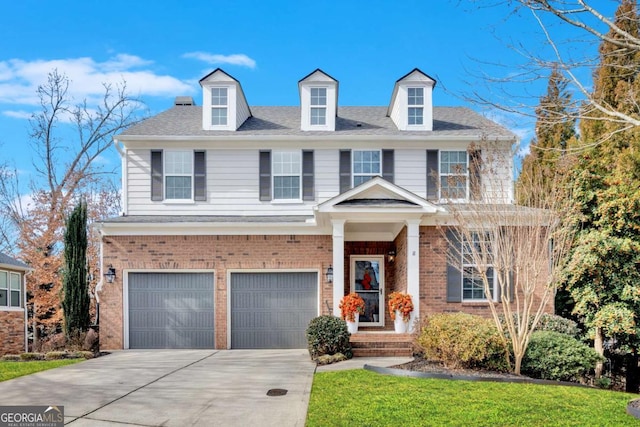 view of front of house featuring a shingled roof, brick siding, driveway, and an attached garage