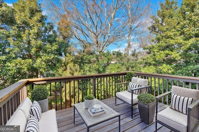 wooden deck featuring an outdoor hangout area