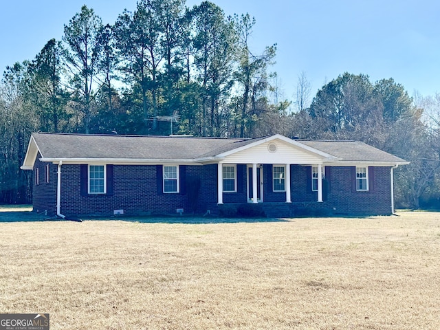 ranch-style home with crawl space, a front yard, and brick siding