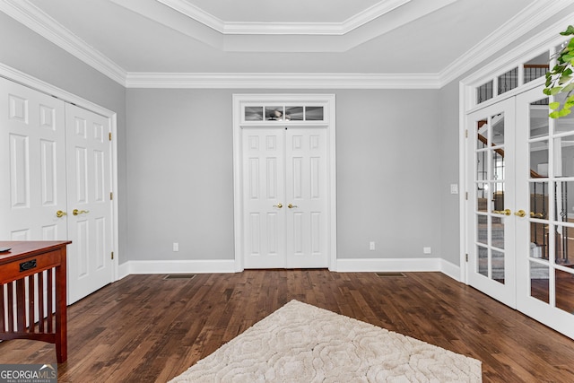 bedroom with french doors, crown molding, wood-type flooring, and baseboards