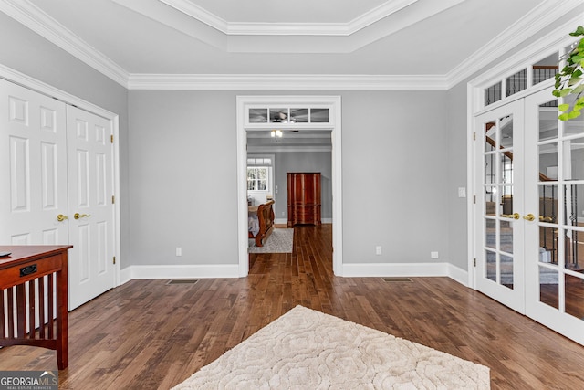 bedroom with ornamental molding, french doors, baseboards, and hardwood / wood-style floors