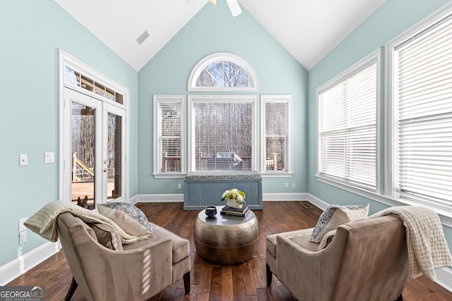 sitting room with wood-type flooring, french doors, and baseboards