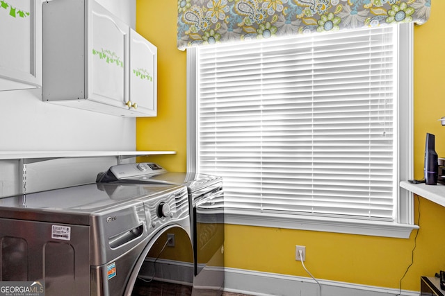 laundry room with washer and dryer and cabinet space