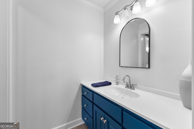 bathroom with crown molding, vanity, and baseboards