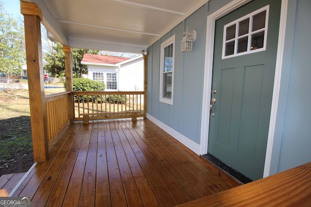 wooden terrace with a porch