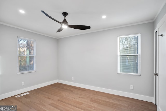 unfurnished bedroom featuring visible vents, crown molding, and baseboards