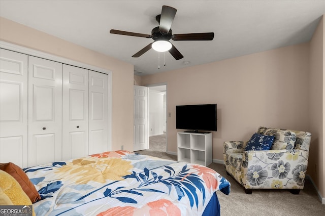 bedroom with carpet floors, a closet, a ceiling fan, and baseboards