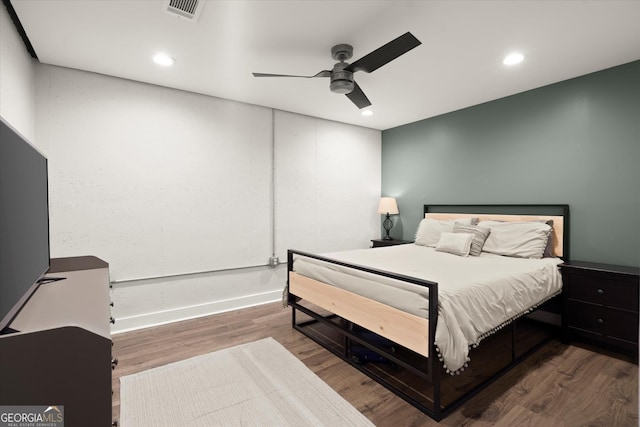 bedroom featuring recessed lighting, visible vents, ceiling fan, wood finished floors, and baseboards