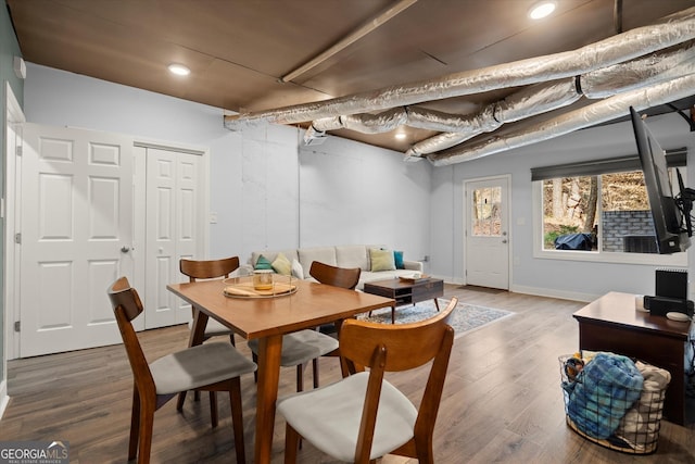 dining room featuring baseboards and wood finished floors