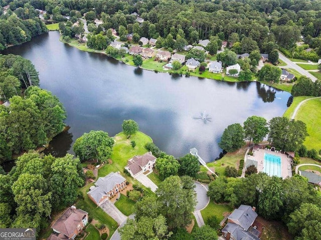 bird's eye view with a water view