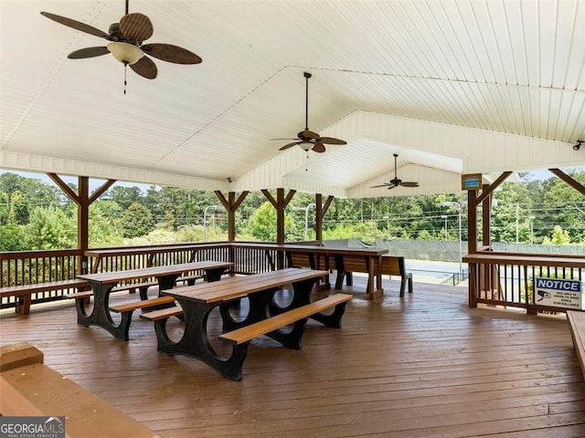 deck featuring outdoor dining space and a ceiling fan